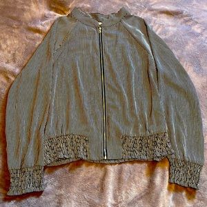 A zip up top perfect to throw over a top for fashion yet still sophisticated